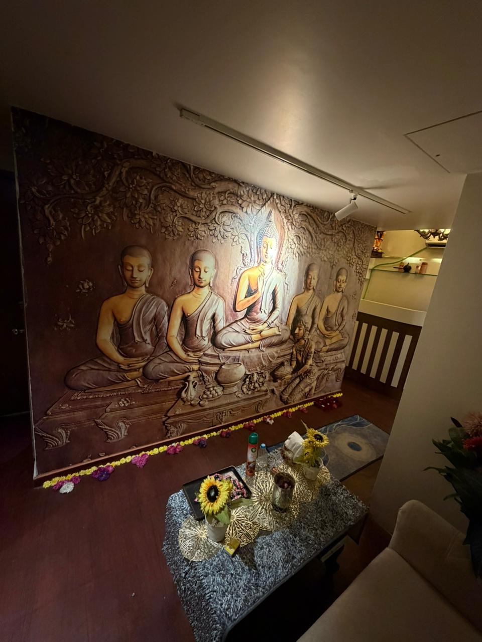 Golden Buddha mural wall at Kings Luxury Spa